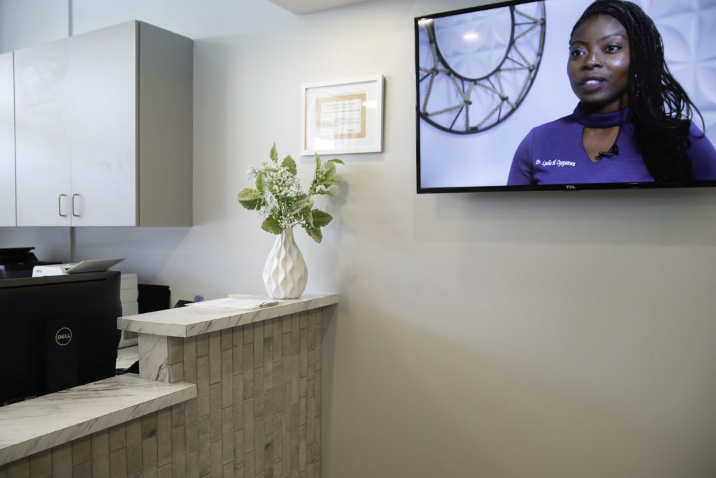 Reception area where patients check in for restorative dentistry services at O2 Dental Group of Wilmington. 